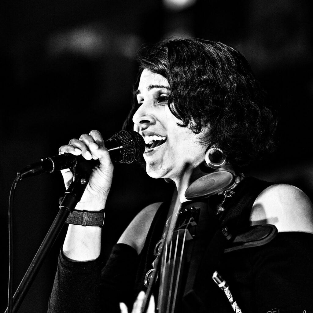 black and white image of a woman singing