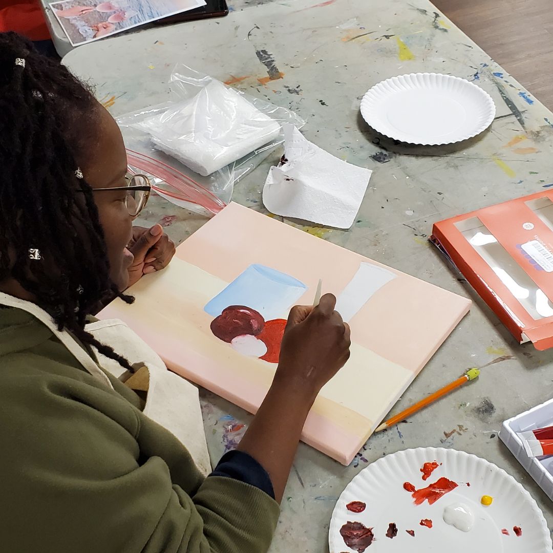 woman painting acrylic still life